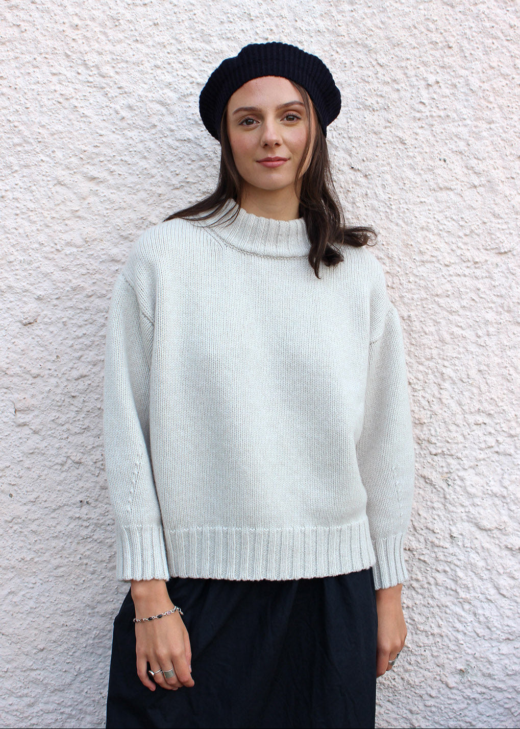 Lambswool navy beret shown on model. Scottish Textiles Showcase.
