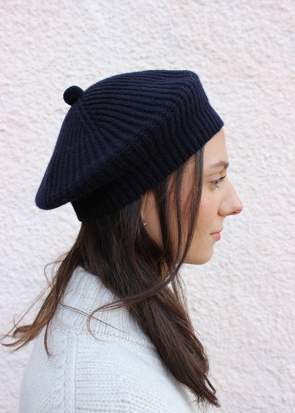 Lambswool navy beret shown on model. Scottish Textiles Showcase.
