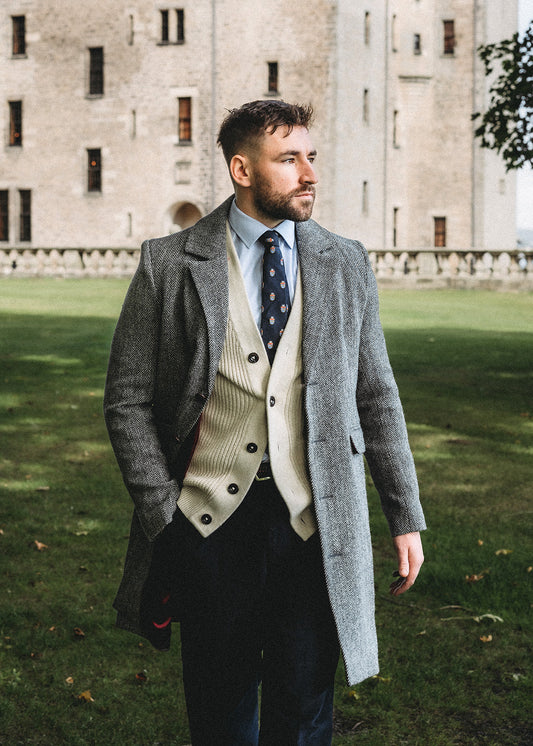 Men's Harris Tweed coat in classic grey herringbone.