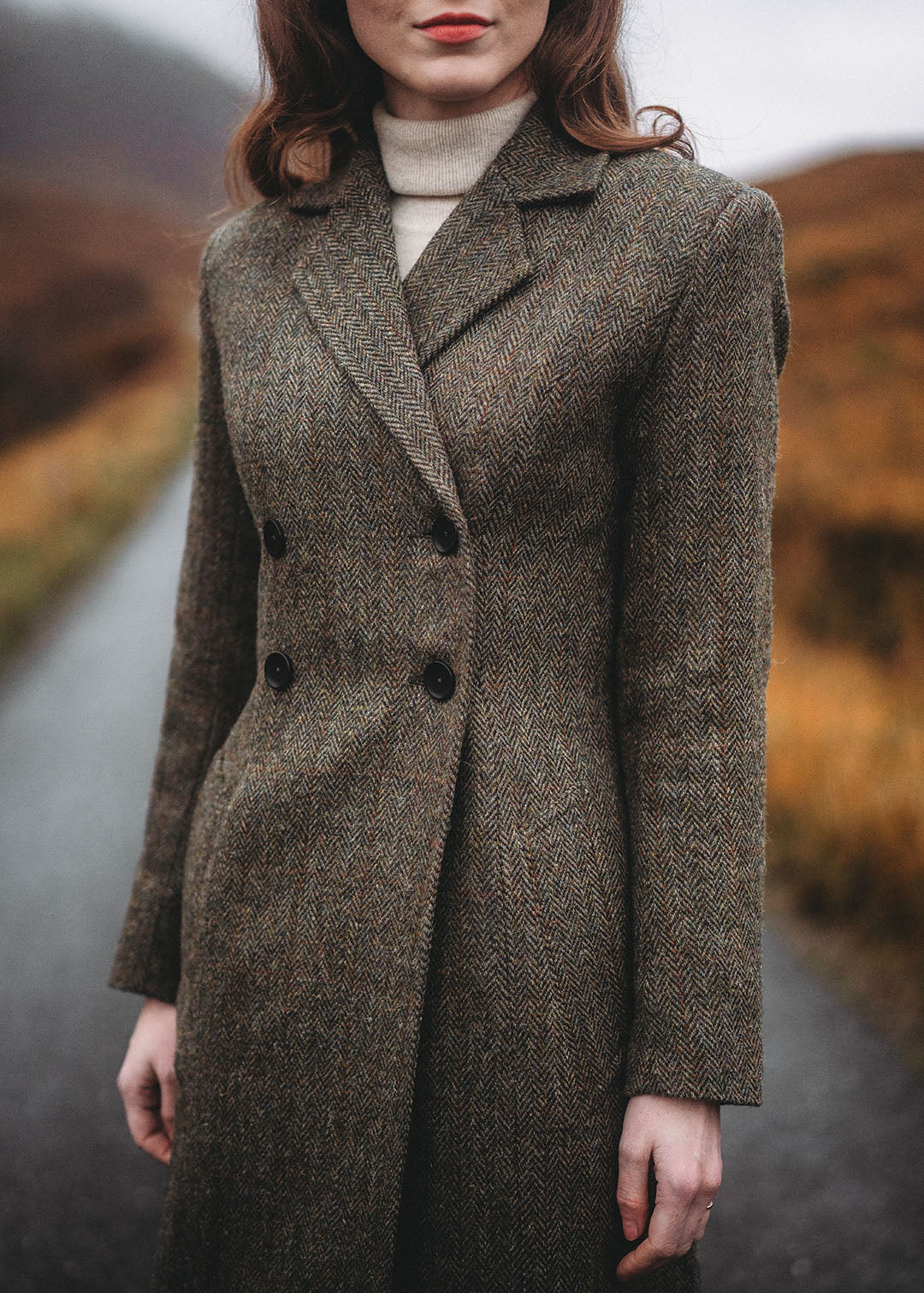 Harris Tweed Ellen coat in Autumn Herringbone photographed in Glencoe. Scottish Textiles Showcase.