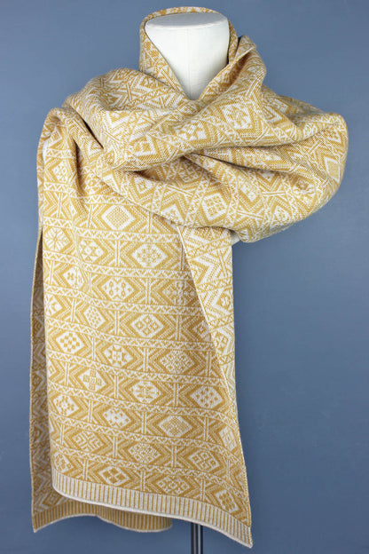 Fair Isle designs intricately patterned merino neck cowl is knitted in muted tones of flax and white.