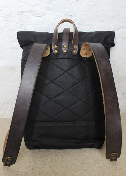 Harris Tweed in brown and white small check and Waxed Cotton Canvas backpack with black leather trim. Made in Scotland