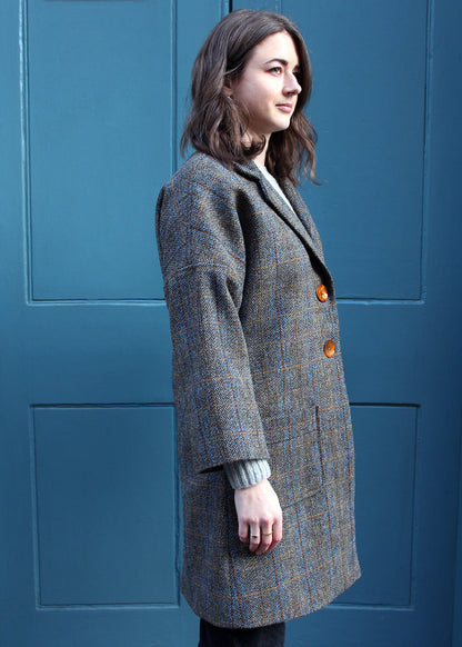 Classic ladies Harris Tweed coat in a traditional grey and brown herringbone check.