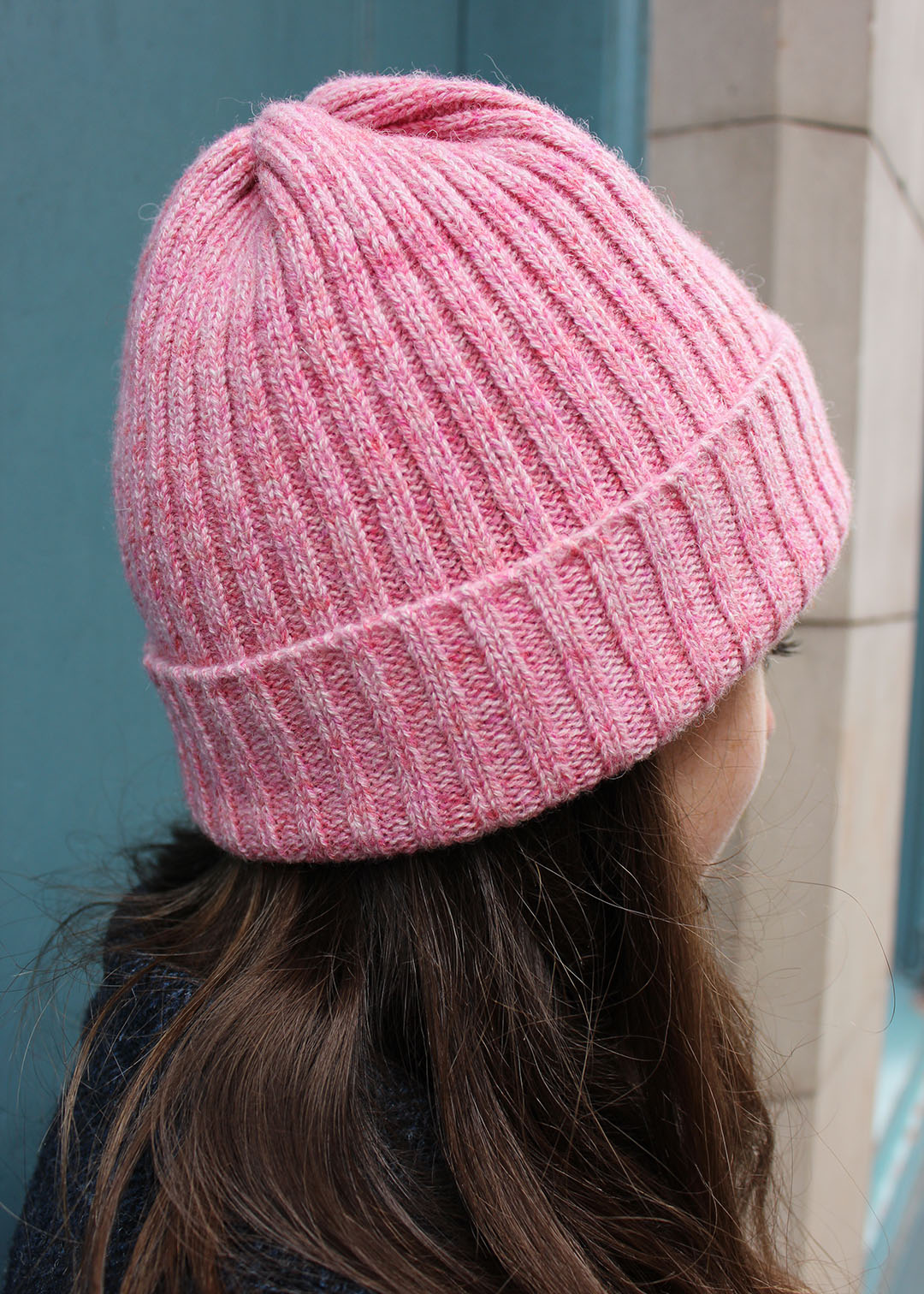 Handmade in Scotland, this beanie in peony pink is crafted from cashmere and British Wool.