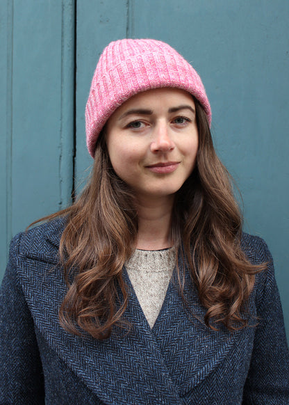 Handmade in Scotland, this beanie in peony pink is crafted from cashmere and British Wool.