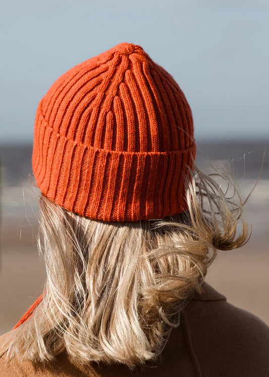 Ribbed knit beanie hat in deep orange Furnace colour. Scottish Textiles Showcase.