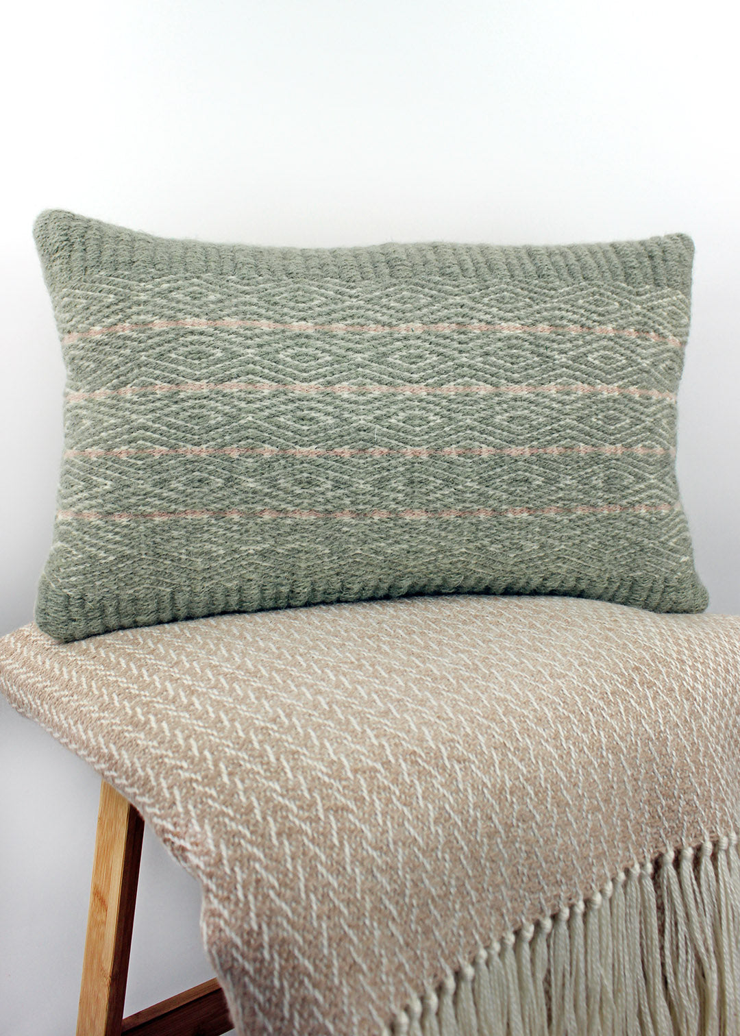 Limited edition, handwoven wool cushion in sage green and blush pink. Made in Edinburgh by spinner, dyer and weaver Kristina Taylor.