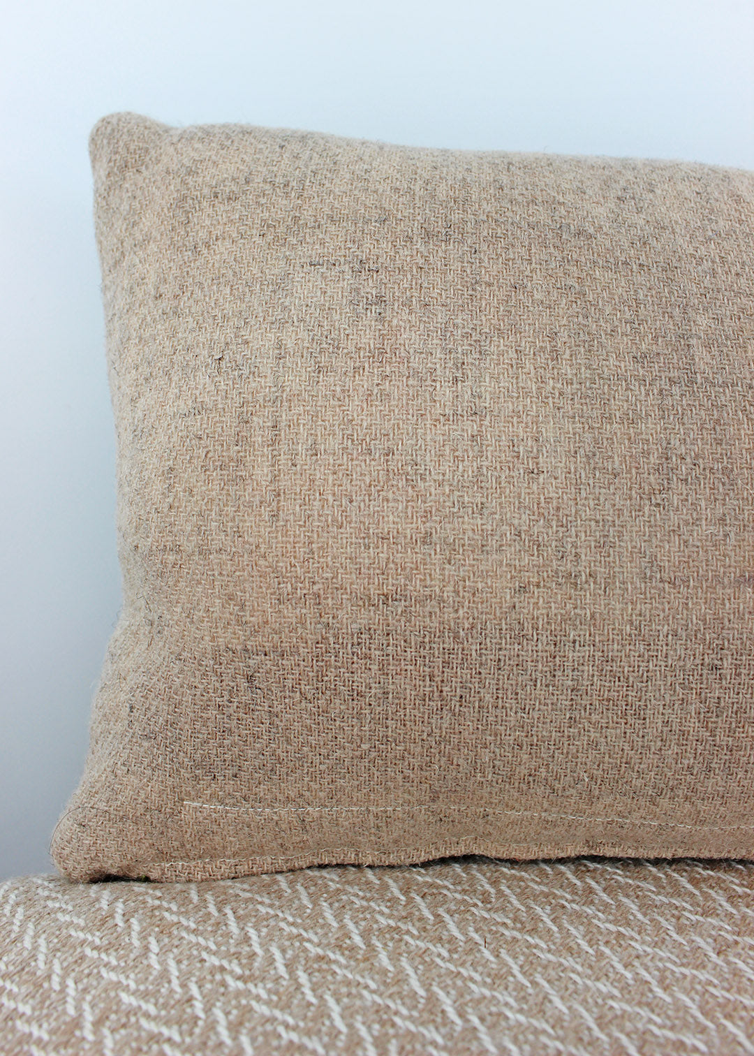 Limited edition, handwoven wool cushion in sage green and blush pink. Made in Edinburgh by spinner, dyer and weaver Kristina Taylor.