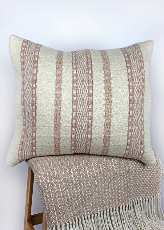 Limited edition, handwoven wool cushion in natural cream and blush pink