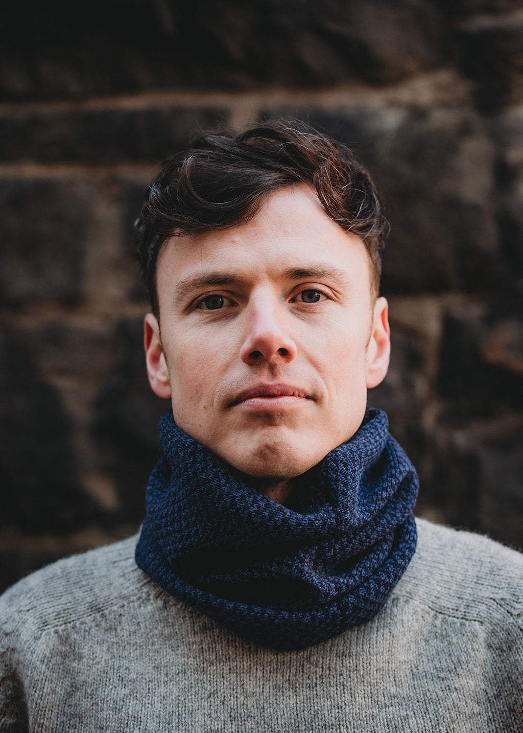 Lambswool knitted neck warmer shown on model.