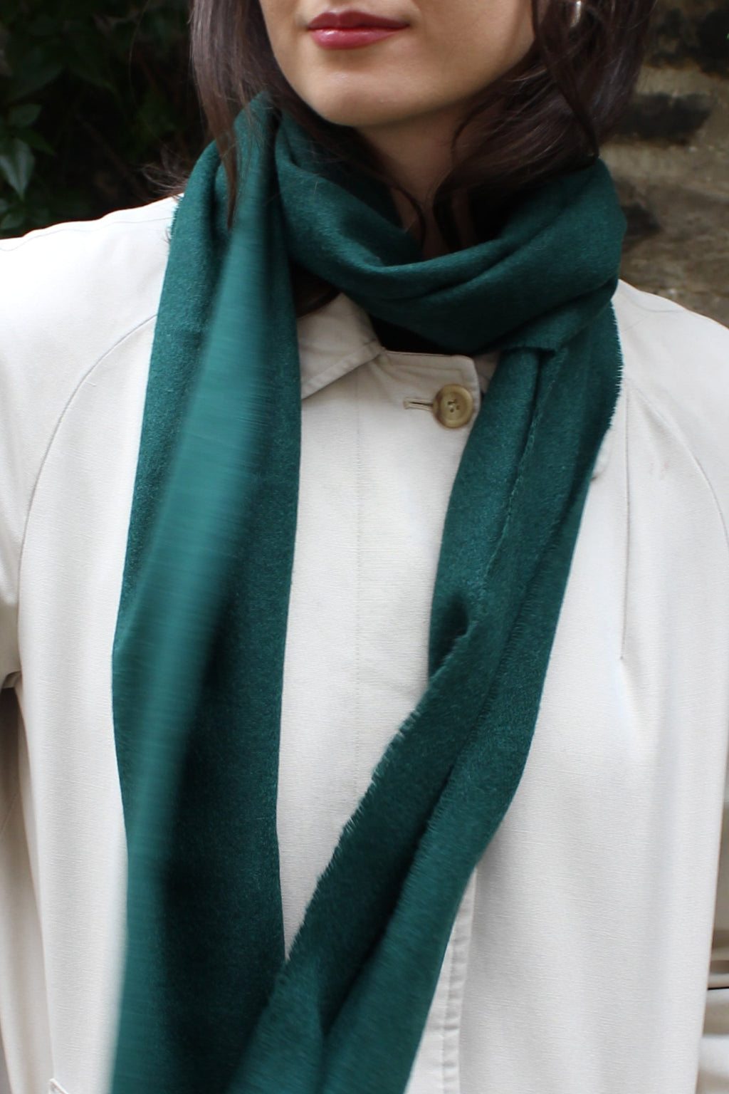 Cashmere scarf in forest green shown on model. 