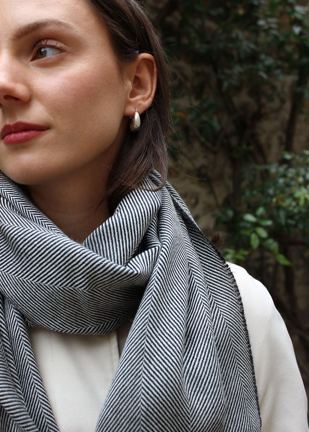 Silk and cashmere stole in graphite and white herringbone. 