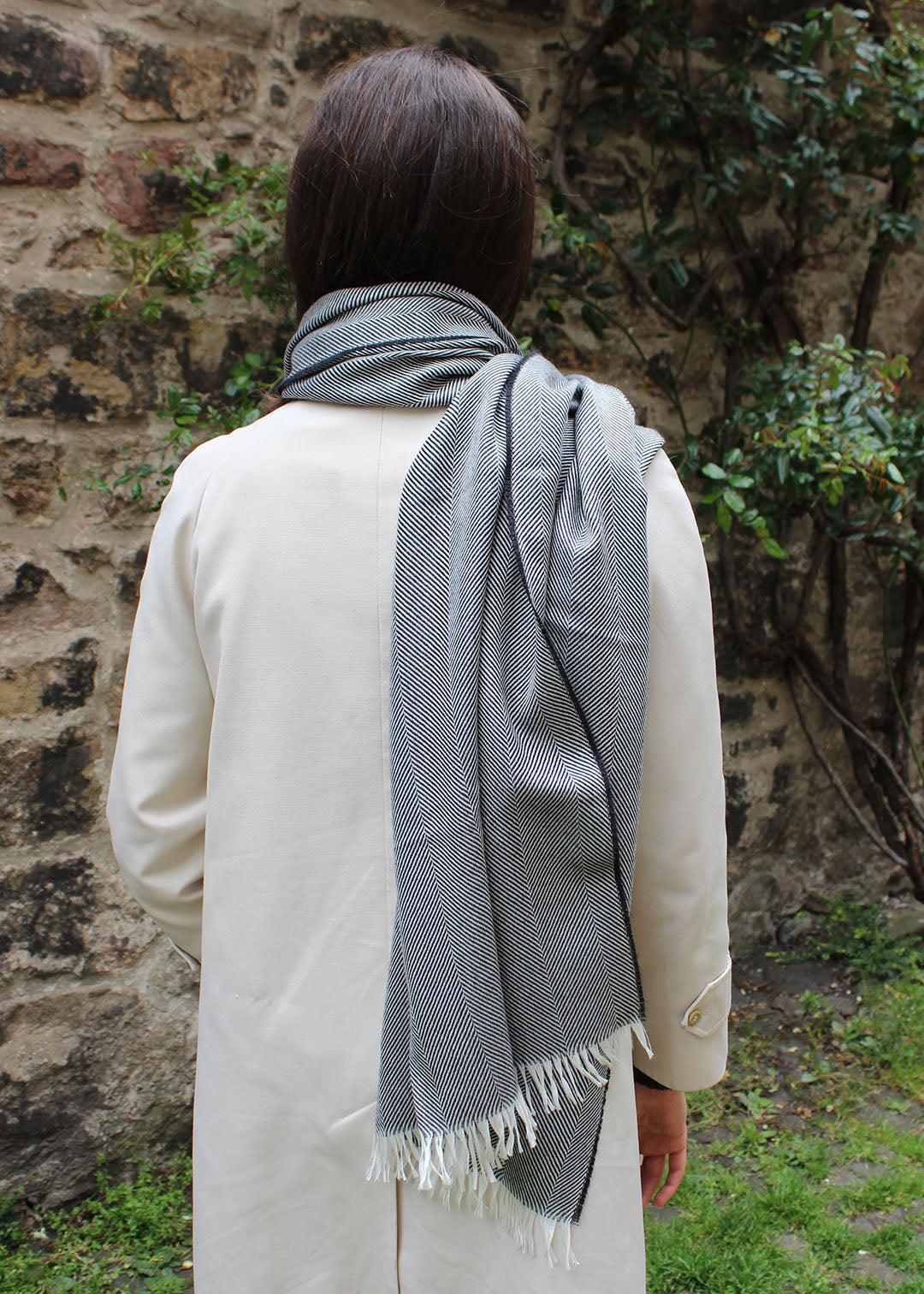 Silk and cashmere stole in graphite and white herringbone. 