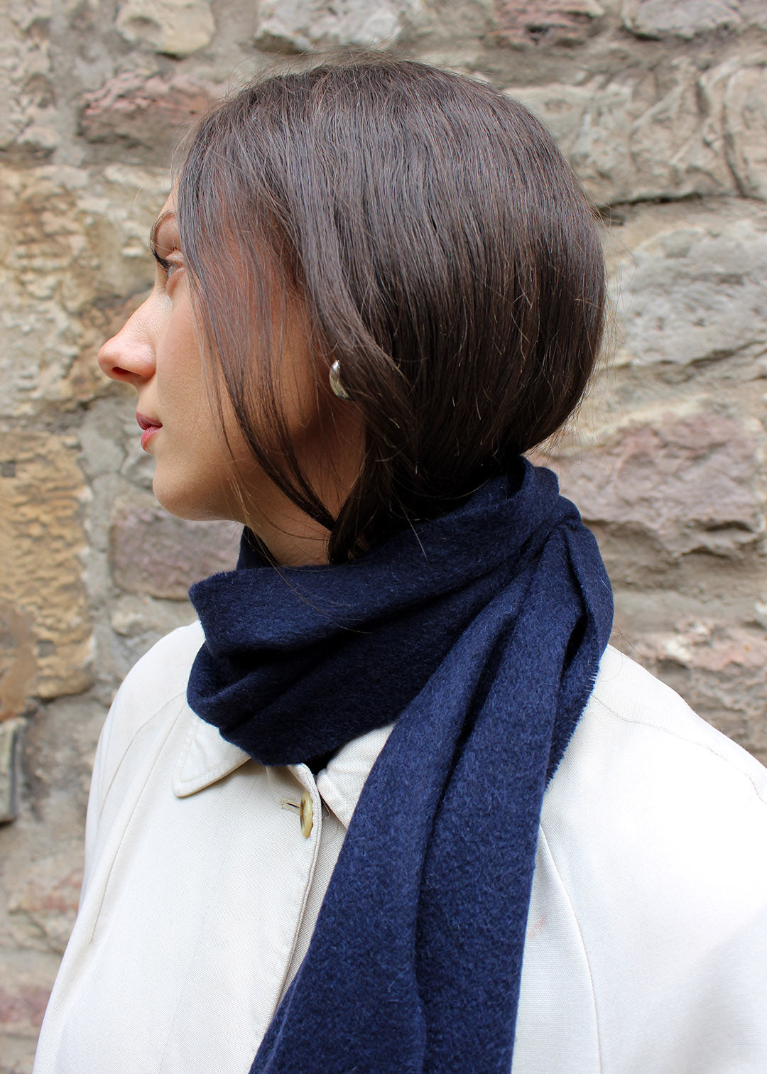 Cashmere scarf in navy shown on model. 