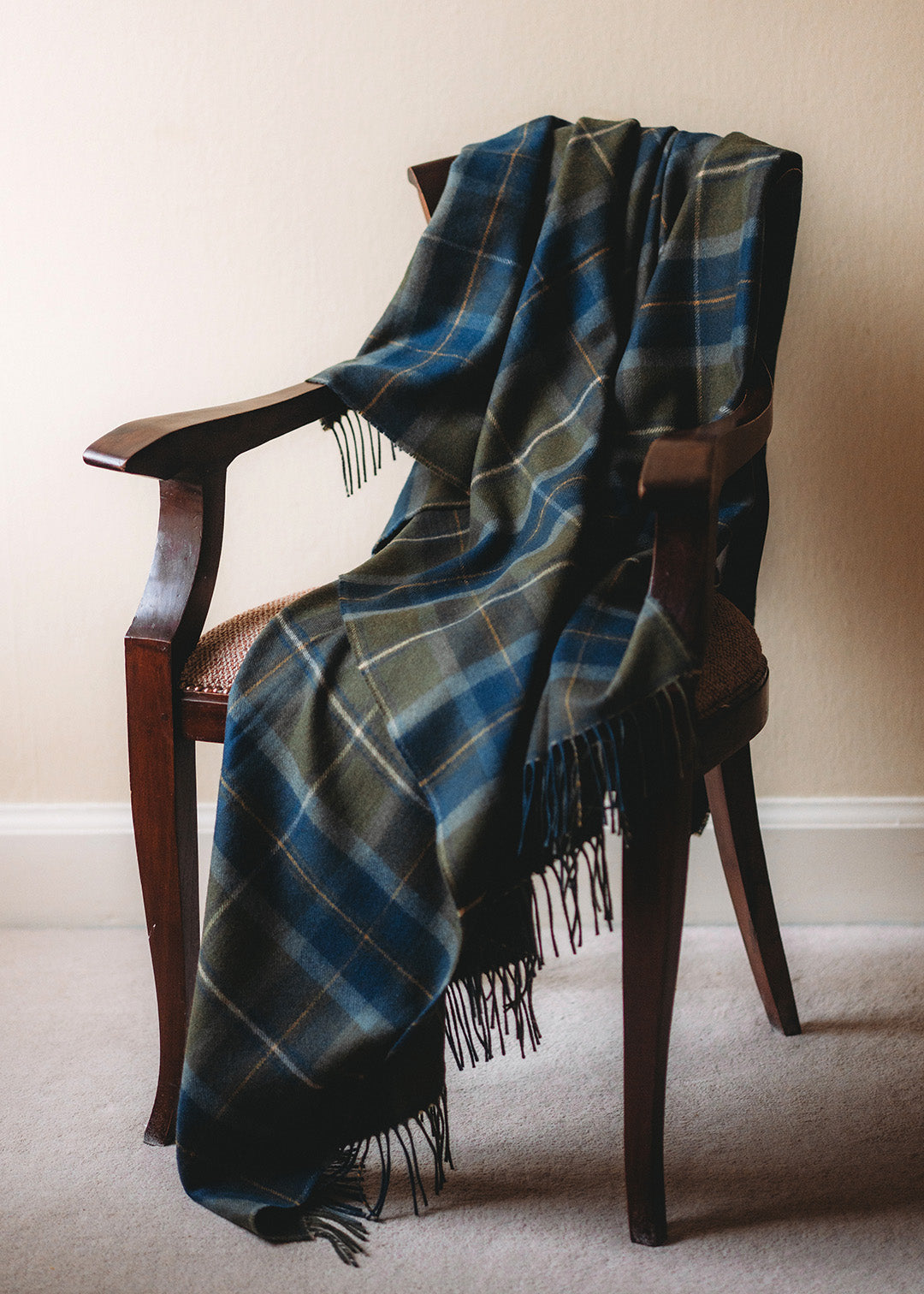 Lambswool blanket woven in Borderland tartan.
