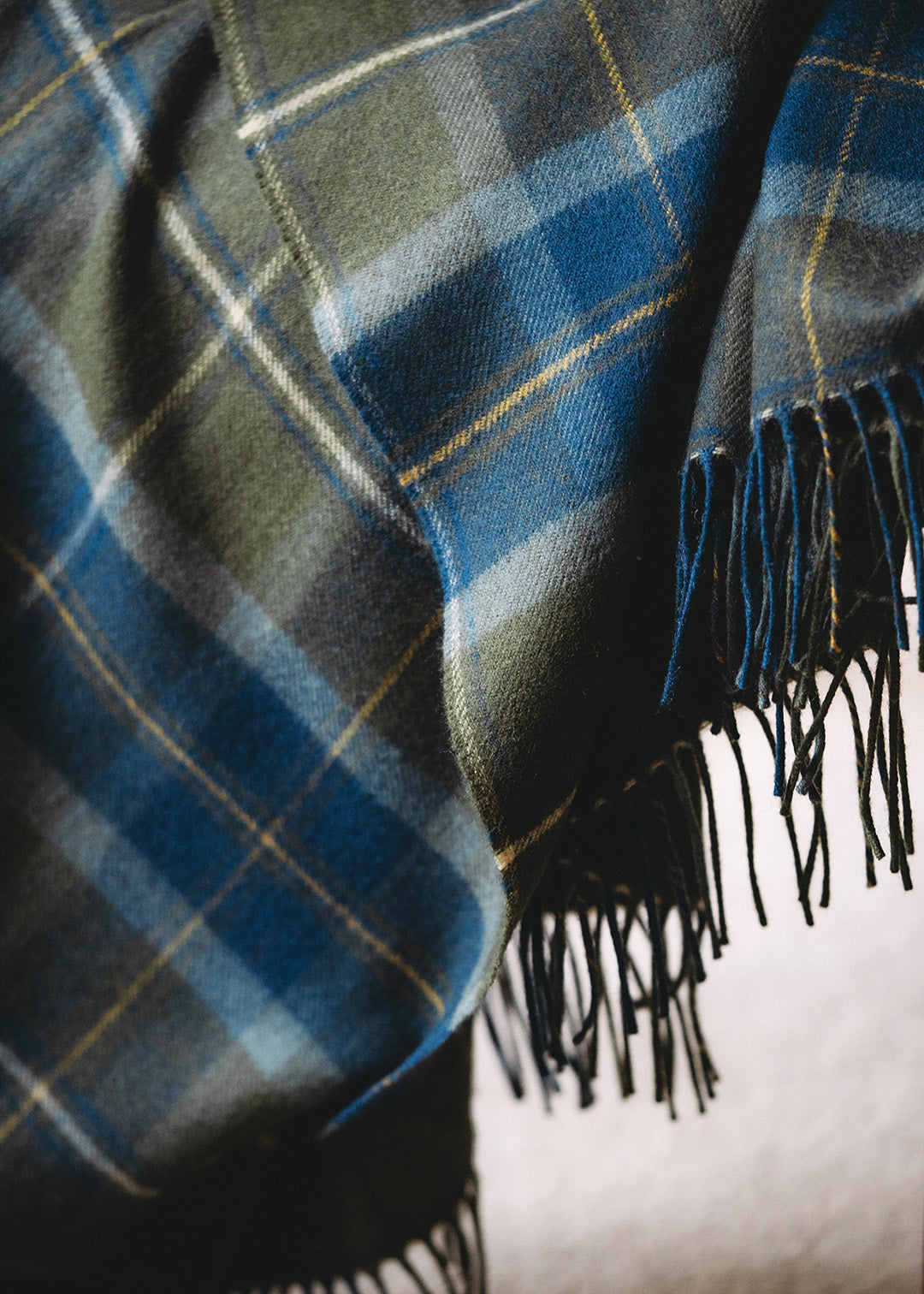 Lambswool blanket woven in Borderland tartan.