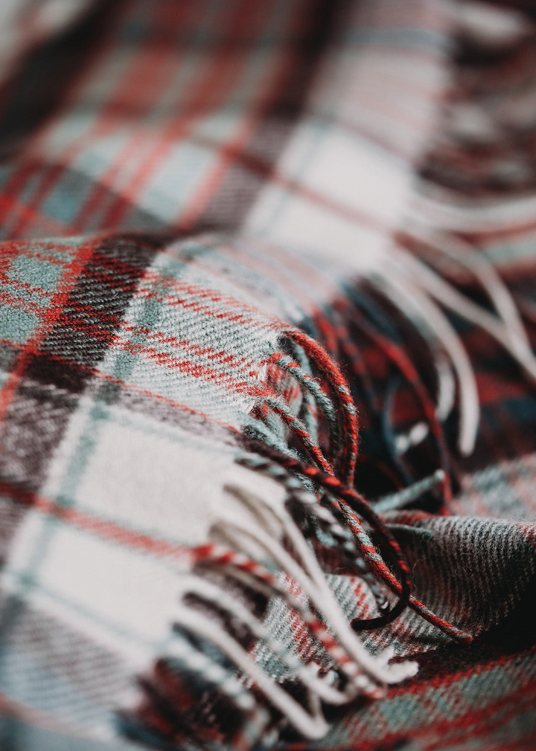 Lambswool blanket woven in MacDonald Dress tartan.