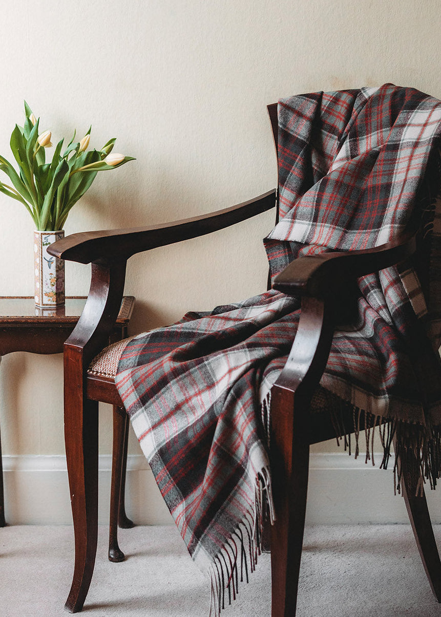 Lambswool blanket woven in MacDonald Dress tartan.