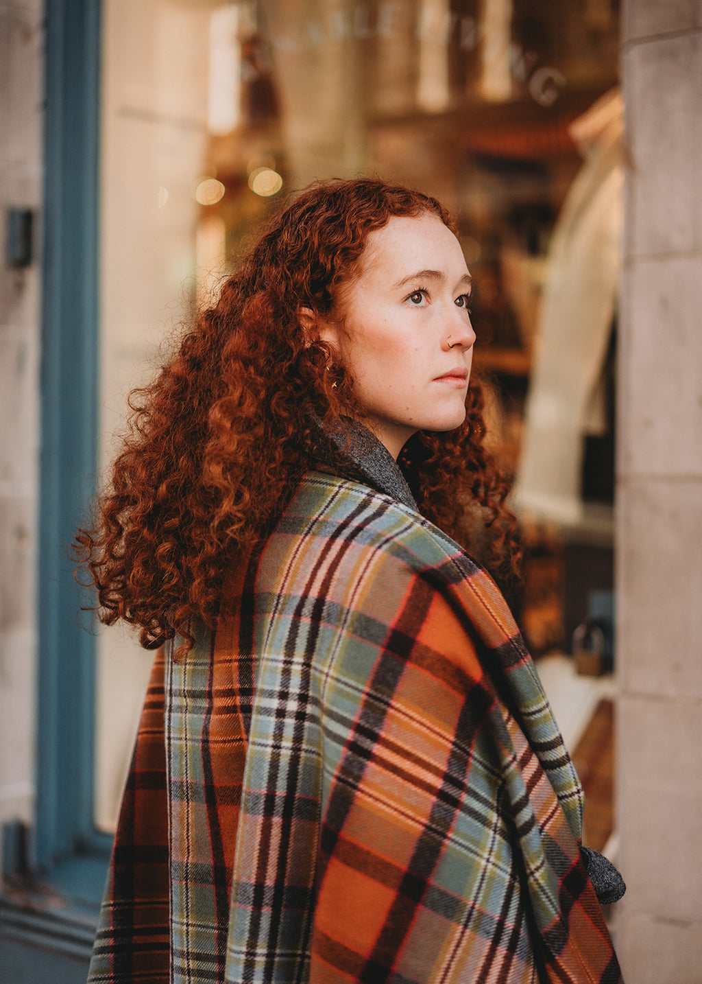 Lambswool tartan blanket sole in Dundee Old Weathered tartan. 

