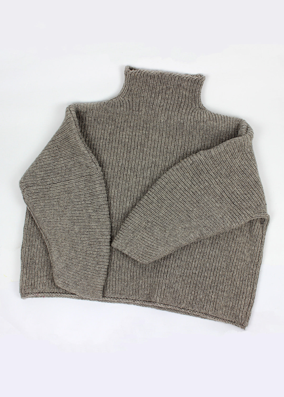 Luxury hand frame knitted jumper made with un-dyed, natural grey wool from Shetland sheep.