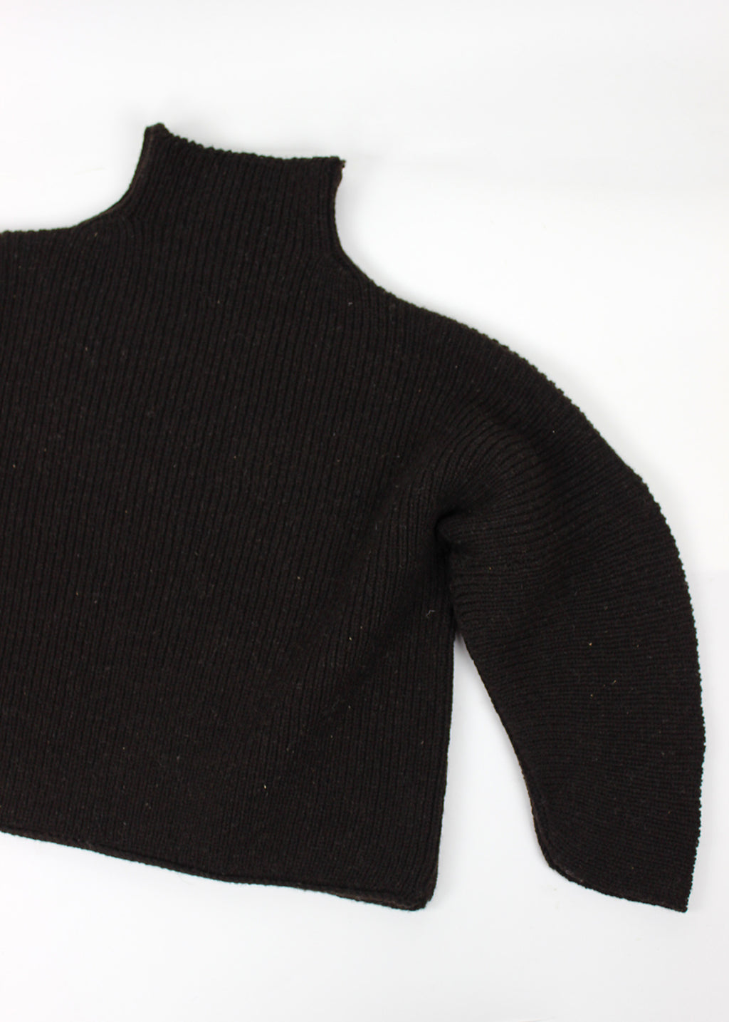 Luxury hand frame knitted jumper made with un-dyed, dark brown wool from Shetland sheep.