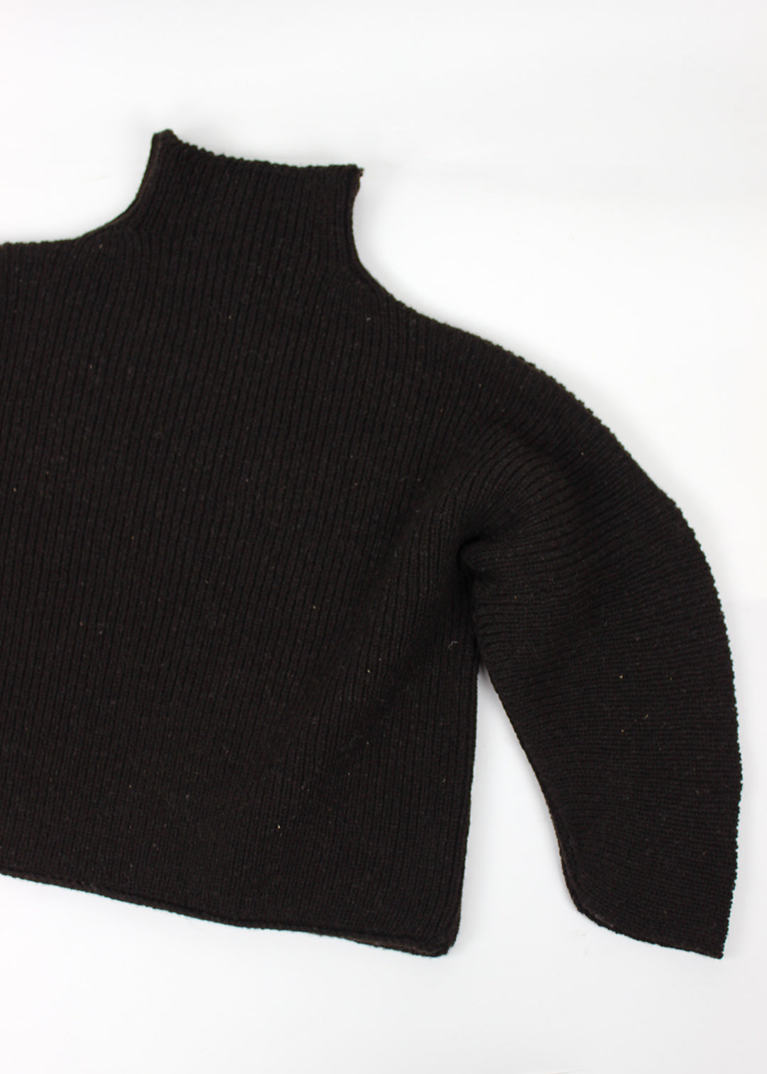 Luxury hand frame knitted jumper made with un-dyed, dark brown wool from Shetland sheep.