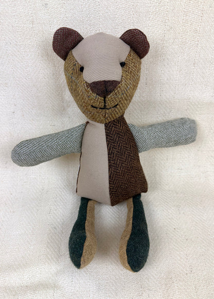 Tweed patchwork bear in browns, greens and oranges. Scottish Textiles Showcase.