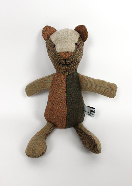 Tweed patchwork bear in browns, greens and oranges. Scottish Textiles Showcase.