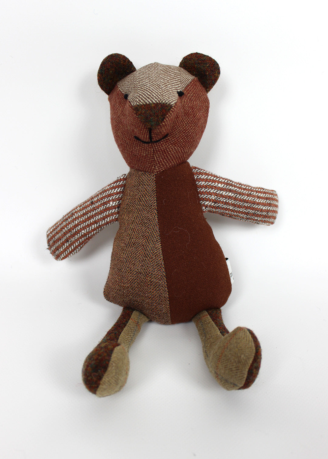 Tweed patchwork bear in browns, greens and oranges. Scottish Textiles Showcase.