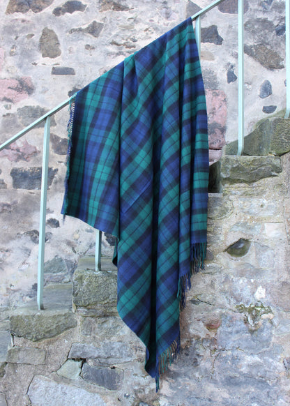 Lambswool tartan blanket woven in iconic navy, black and bottle green of the Black Watch tartan. Made in the Scottish Borders. Scottish Textiles Showcase.