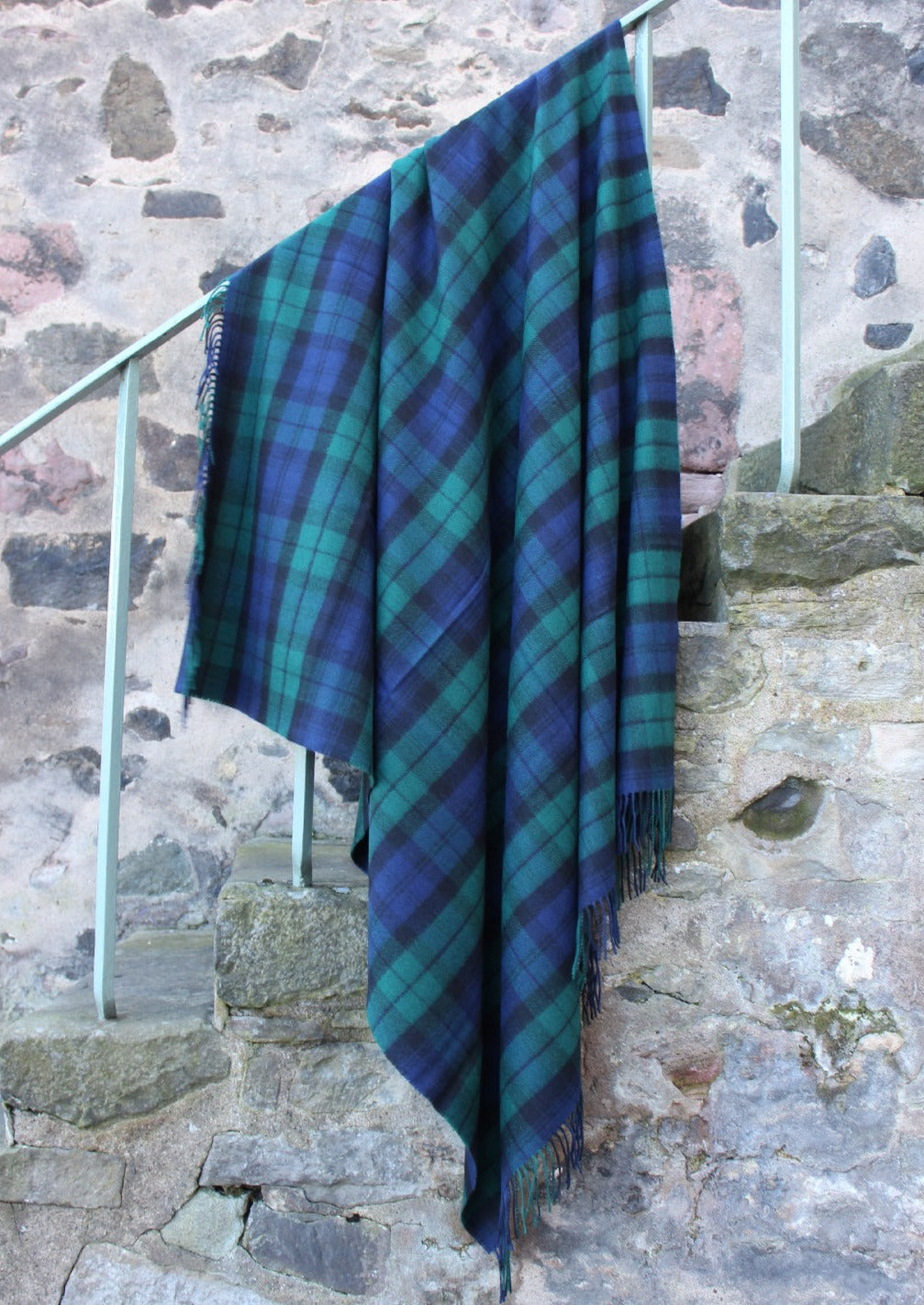 Lambswool tartan blanket woven in iconic navy, black and bottle green of the Black Watch tartan. Made in the Scottish Borders. Scottish Textiles Showcase.