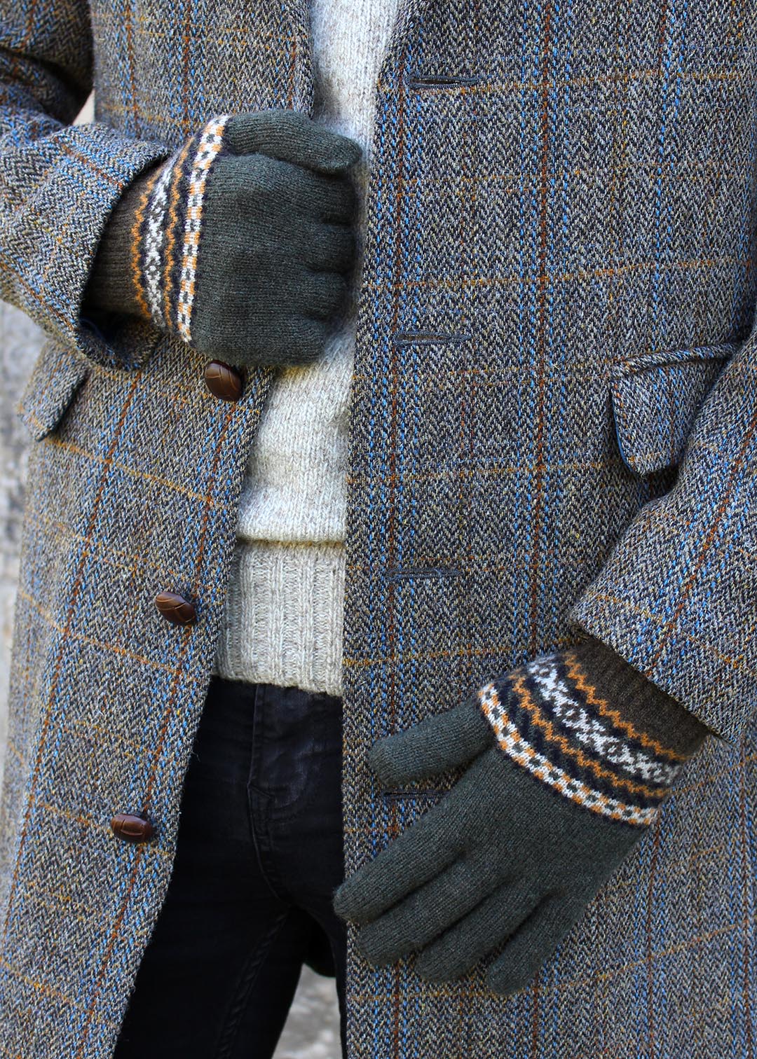 Fairisle mens gloves shown on model. Scottish Textiles Showcase.