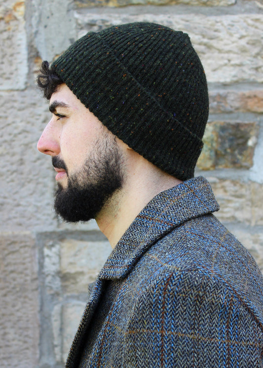 Classic ribbed beanie knitted in ivy green with speckles of burnt umber, red and green. Scottish Textiles Showcase.