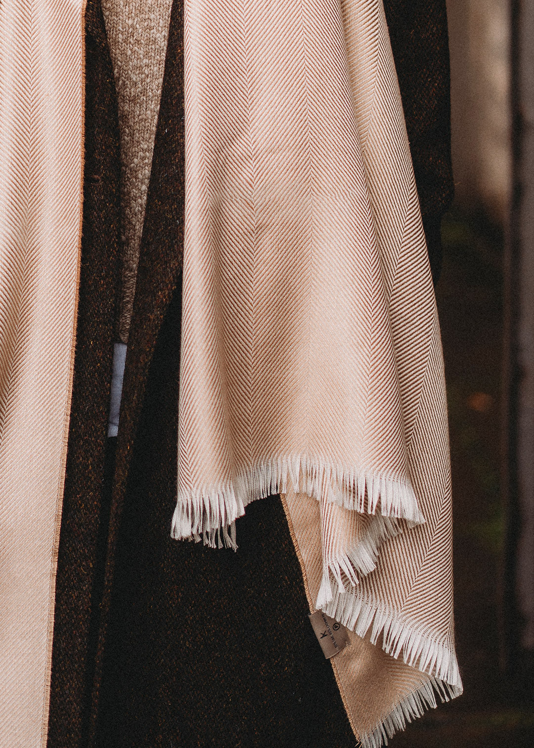 Silk and cashmere stole in camel and ivory herringbone.
