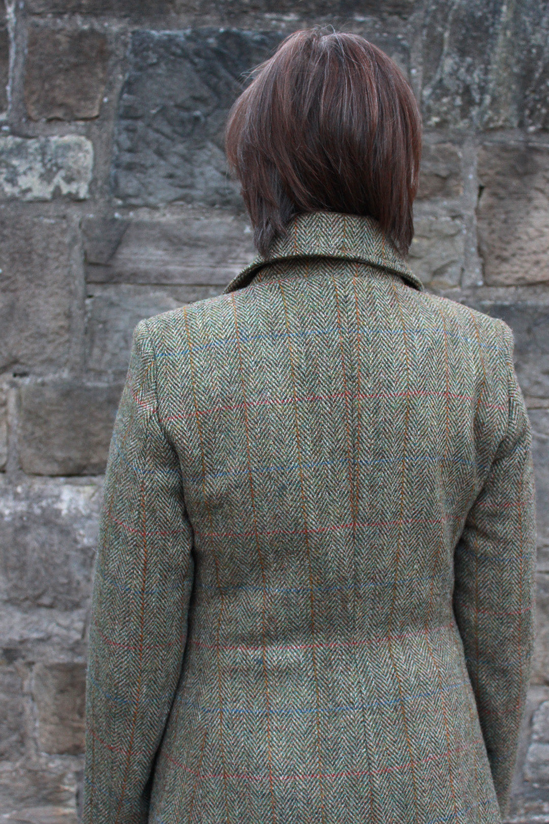 Marta coat is the latest style by Scottish designer Elizabeth Martin. This maxi length Harris Tweed® coat features offset buttons and a contrasting blue satin lining.
