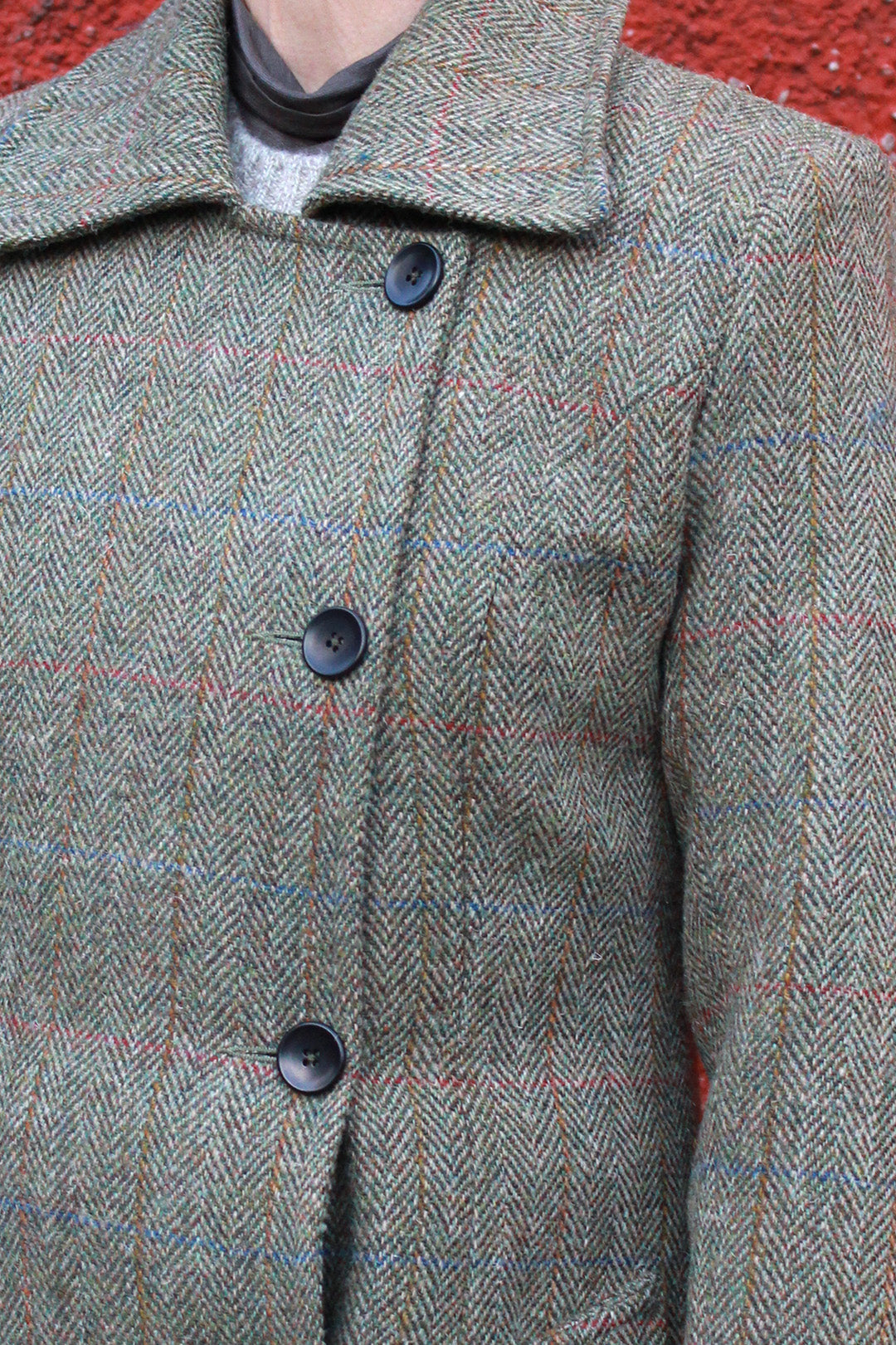 Marta coat is the latest style by Scottish designer Elizabeth Martin. This maxi length Harris Tweed® coat features offset buttons and a contrasting blue satin lining.