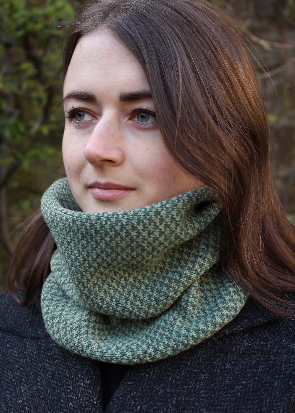 Merino lambswool neck warmer in soft shades of green with a design inspired by the Hebridean sea on the crossing to the Isle of Harris.