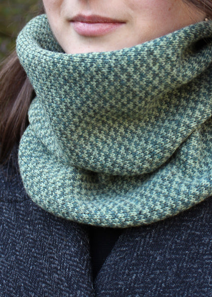 Merino lambswool neck warmer in soft shades of green with a design inspired by the Hebridean sea on the crossing to the Isle of Harris.