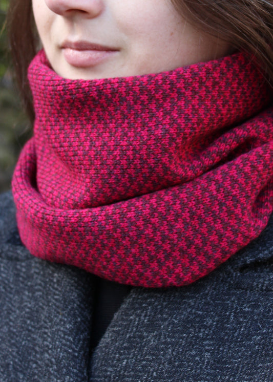 Merino lambswool neck warmer in ruby red and burgundy with a design inspired by the Hebridean sea on the crossing to the Isle of Harris.