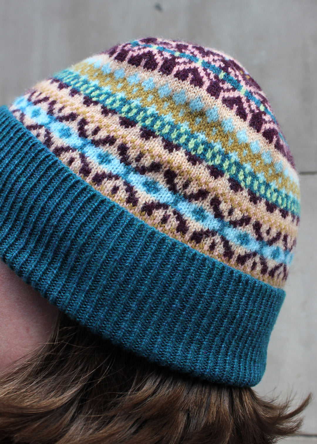 Lambswool fair isle hat in teal colourway. Scottish Textiles Showcase.