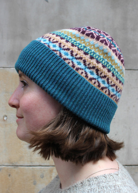 Lambswool fair isle hat in teal colourway. Scottish Textiles Showcase.