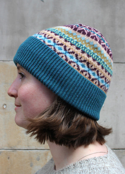 Lambswool fair isle hat in teal colourway. Scottish Textiles Showcase.