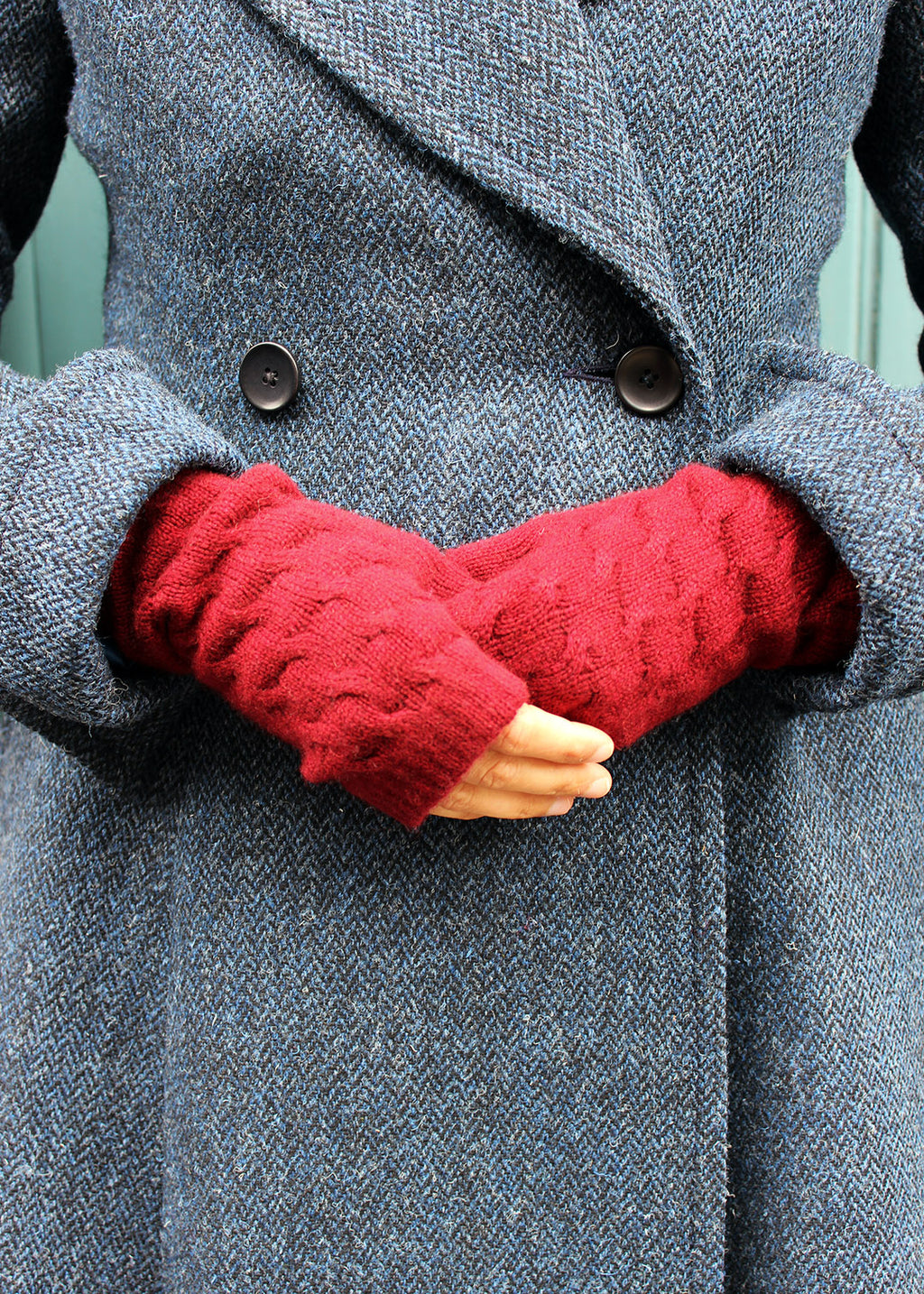 Cherry red, cable knit cashmere wristwarmers.