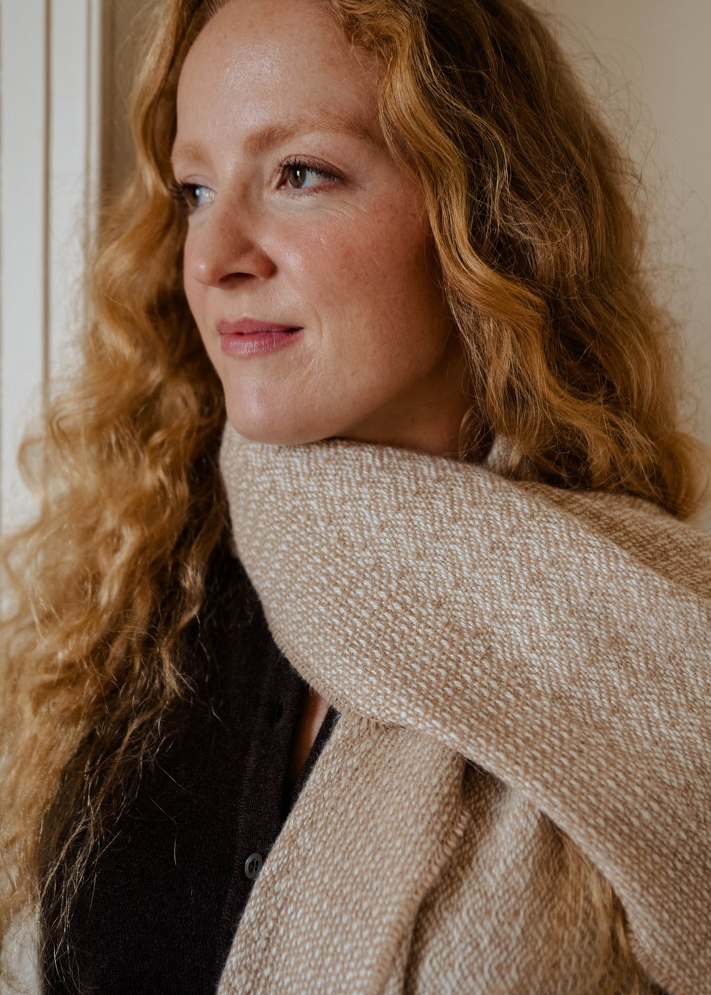 Un-dyed alpaca scarf in warm caramel and off-white, woven in an intricate rippling barley design.