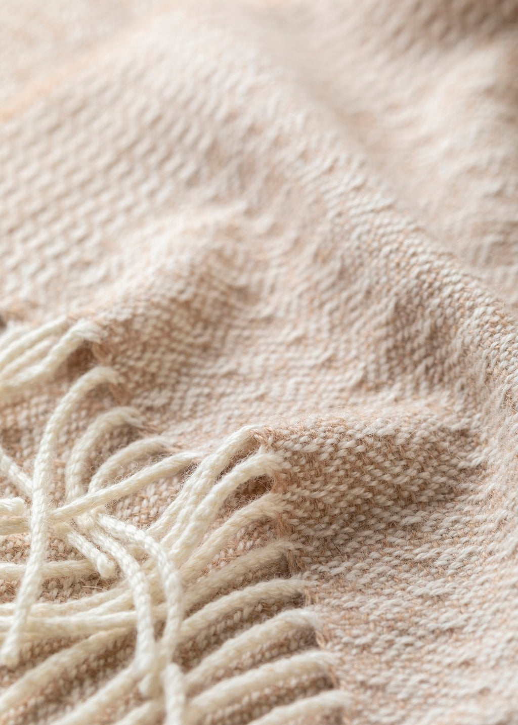 Un-dyed alpaca scarf in warm caramel and off-white, woven in an intricate rippling barley design.