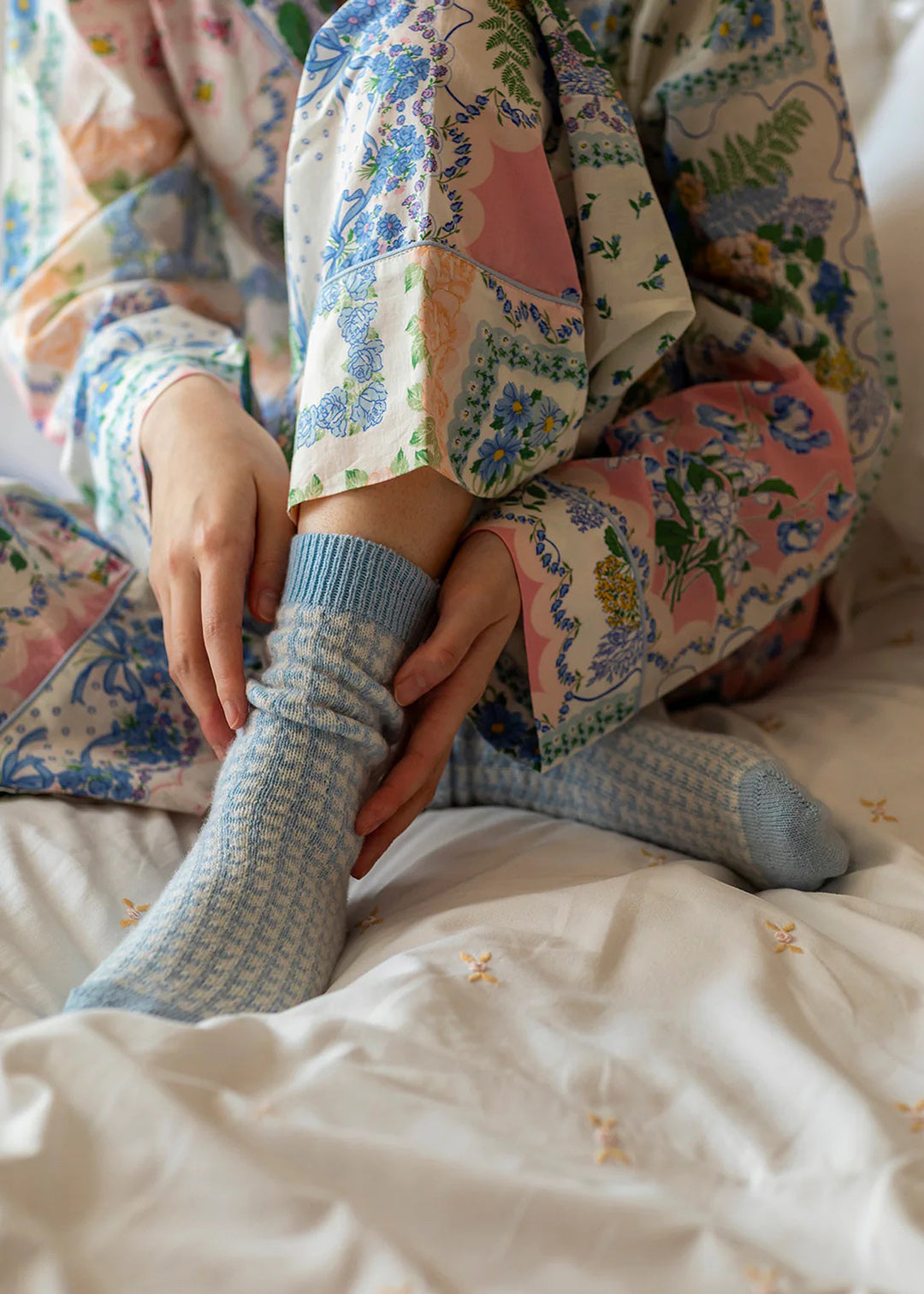 These cashmere bed socks come in a powder blue houndstooth pattern and will be sure to keep you warm and cosy.