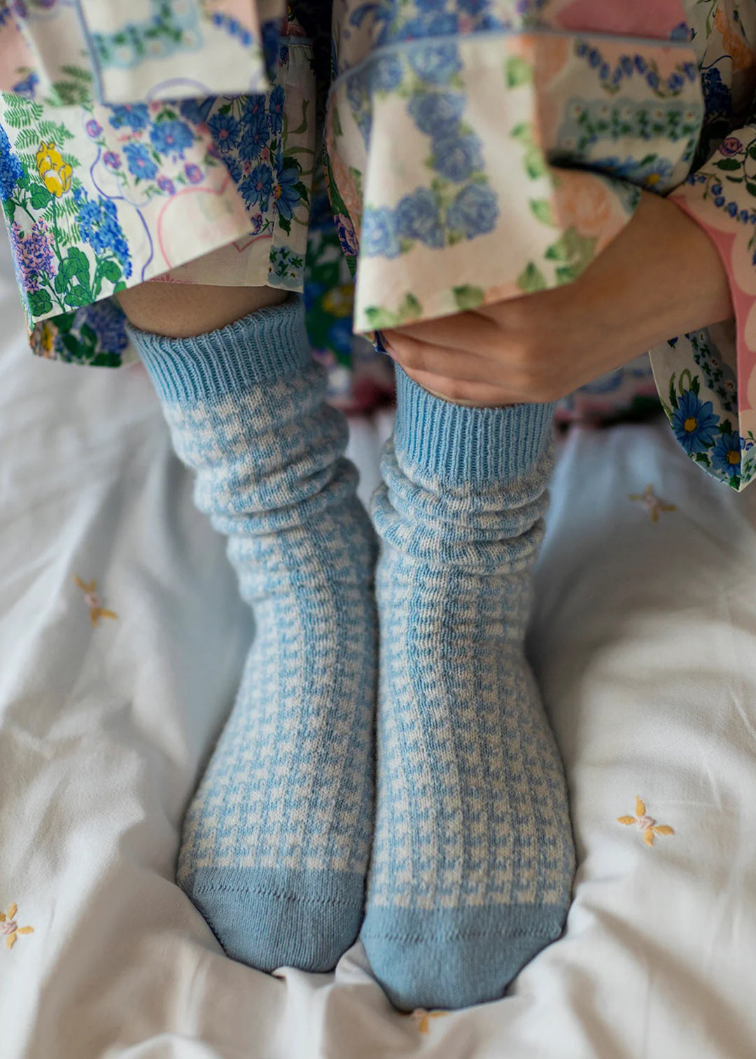 These cashmere bed socks come in a powder blue houndstooth pattern and will be sure to keep you warm and cosy.