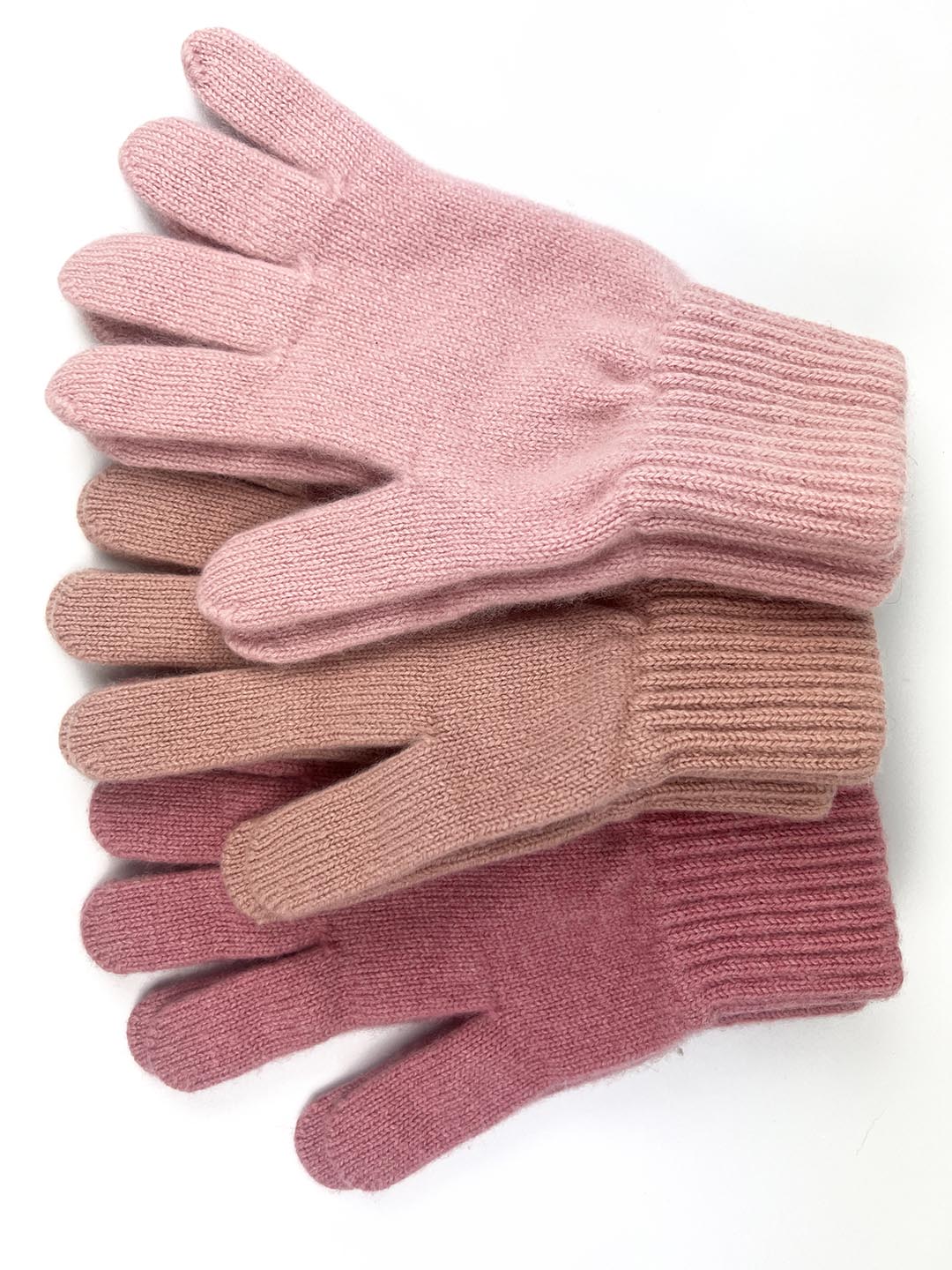 Rosie sugden cashmere gloves in shades of pink. Knitted in the Scottish borders
