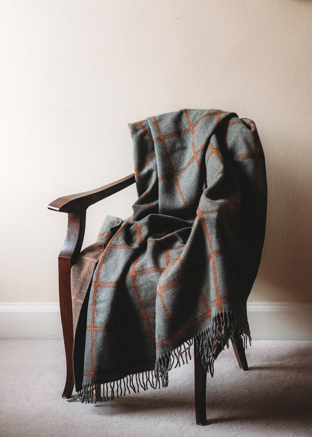 Reversible, checked wool throw in sea blue-green and brown.