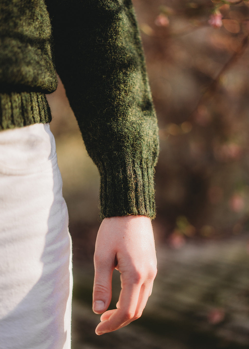 Shetland jumper in pine green shown on model. 